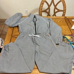 set of pants and jacket in reflective fabric.  Never used,New no tags